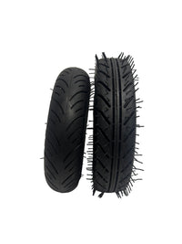 Two black tires with tread patterns on a white background
