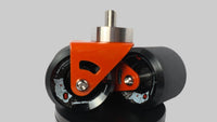 A pair of orange crazy cart wide casters on white background.